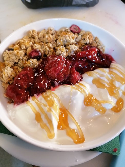 Granola with home made compote and yogurt topped up with honey